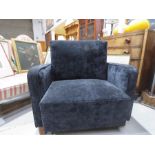 An Art Deco Portuguese black velvet upholstered armchair / bed.