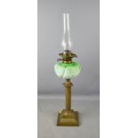 A Victorian brass oil / paraffin lamp, with green opaque glass bowl.