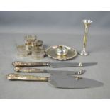 A silver handled pie, cheese, cake, knives, silver bud vase, silver bud vase, silver napkin rings,