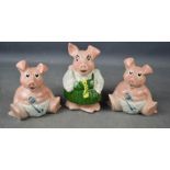 Three Wade Natwest piggy banks.