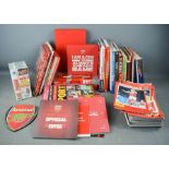 Four Arsenal club membership packs, together with a quantity of sporting books and videos.