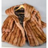A vintage fur coat, silk lined, 3/4 length.