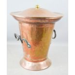 A copper coal bucket with lid