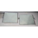 Two chrome wall mirrors, bevelled edge, angle adjustable.
