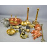 A group of copper and brassware to include Victorian jelly mould, pair of candlesticks, horse