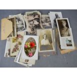 A quantity of antique and vintage postcards and photographs.