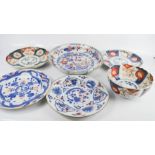 A group of Chinese ceramics including 19th century Imari plates, bowl and others.