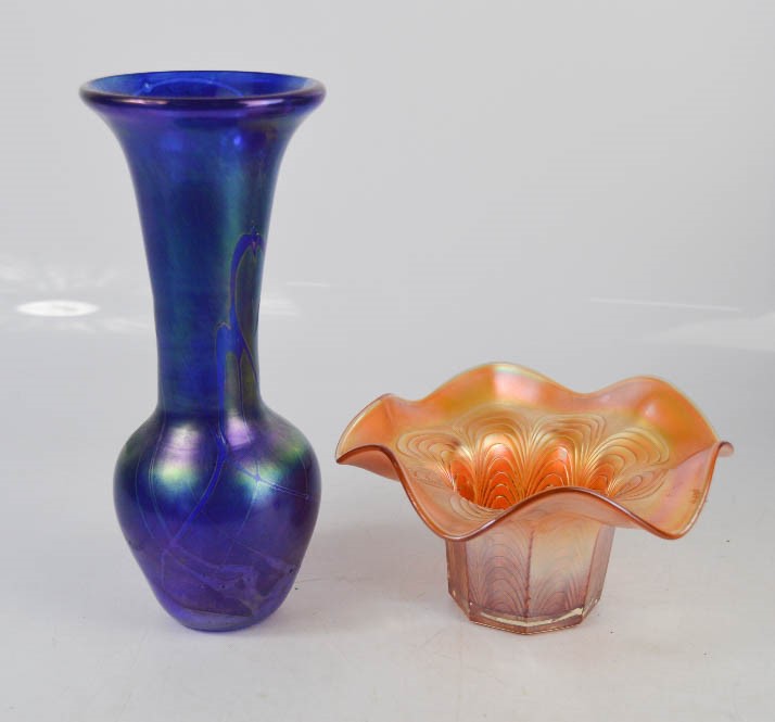 An iridescent blue vase and Carnival glass dish, 20cm high.