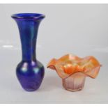 An iridescent blue vase and Carnival glass dish, 20cm high.