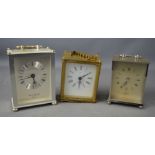 Three carriage clocks; Junghans, Smiths, and London Clock company.