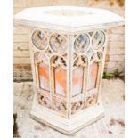 A hexagonal Tudorgate Fort Lauderdale gothic arch reconstituted stone fire pit, with gothic arch