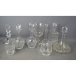 A group of cut crystal decanters.