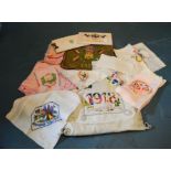 A selection of WWI sweetheart handkerchiefs, needlepoint purse and other related items.