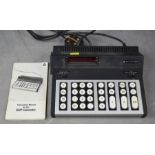 An Advance 162P programmable calculator, 1972, with instruction manual.