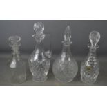 A group of four cut glass decanters, one by Webb Corbett crystal, tallest 33cm high.