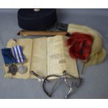 A group of military items to Private George Charity: two spurs, helmet plumes, two medals, cap,