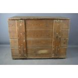 An antique pine travelling chest with single chest and drop down front.