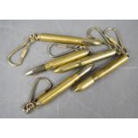 Five bullet casing keyrings.