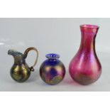 Three iridescent vases / jugs.
