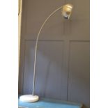 An Arc floor lamp in brushed steel, with marble circular base.