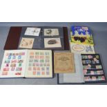 An album of vintage postcards, an album of stamps, and albums of vintage cigarette cards.