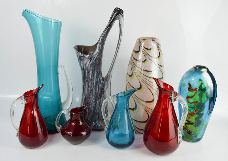 Two Art Glass vases, together with a group of various coloured glass jugs and vases.