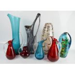 Two Art Glass vases, together with a group of various coloured glass jugs and vases.