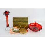 A brass domed casket, a Stratton compact, and a red glass retro bud vase.