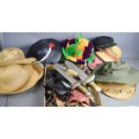 A group of hats to include jesters, sun hats, caps and a group of stage props including Lonestar toy