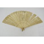 A mid 19th century Chinese carved bovine bone fan.