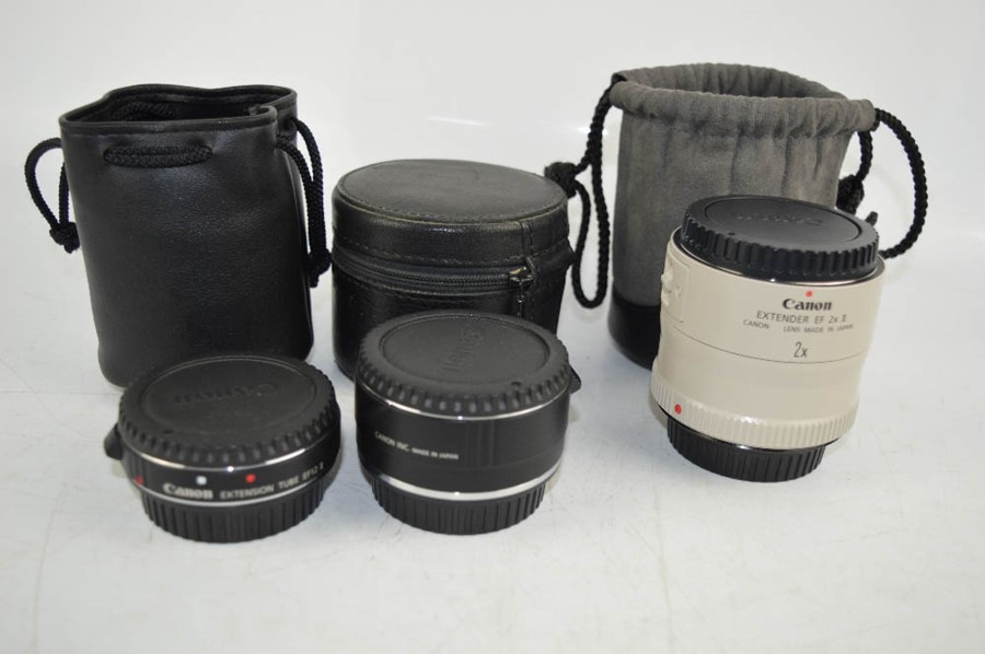 A group of Canon extender lenses, to include EF25, EF12.