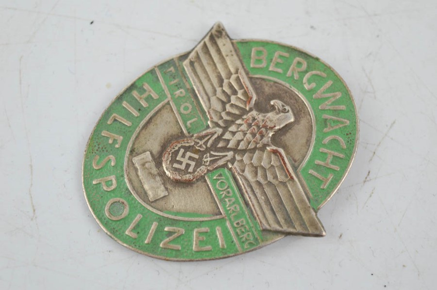 A Budapest 1944/45 Nazi uniform shield, and two military Nazi police badges. - Image 3 of 5