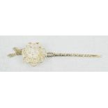 A Chinese Tibetan Miau silver hand carved hair pin with ornate flower head, central rotating petals.