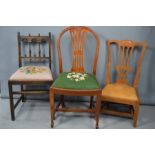 Three chairs: a Scottish oak low chair with leather drop in seat, an oak Ercol Production chair with