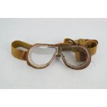 A WWII AM Pilots goggles, stamped 1940.