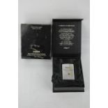 A limited edition zippo lighter, 75 years commemorative edition, in presentation box.