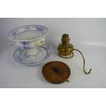 An antique brass oil lamp with an oak wall bracket 18cm high, together with a Victorian comport.