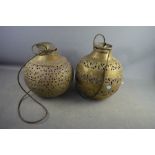 Two Eastern brass lanterns embossed with decoration.