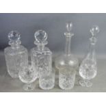 Two pressed glass decanters, an Edwardian decanter and a French decanter, together with crystal