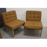 Two mid century office chairs, with metal frames.