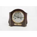 A 1930s Smiths of Enfield mantle clock, with presentation inscription to the front plaque for the