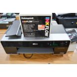 An Epsom Stylus Photo R3000 printer together with ink and paper.