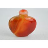 A vintage Chinese red agate hand carved snuff bottle.