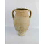 An ancient Amphora vase, terracotta with interior glaze.