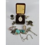 A quantity of silver including pendants, Victorian brooches, rise brooch and earring set and other