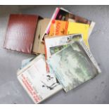 A group of LPs and 78s, one Elvis Presley example, in a faux snakeskin case.