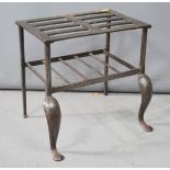 A late 19th/early 20th century cast metal kettle stand, with shaped legs.