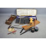A quantity of collectables including medicine glass, cribbage board, carving set, corkscrew, glove