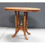 A Victorian inlaid oval side table.