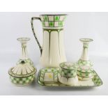 A Royal Doulton part dressing table set in the clover leaf pattern, including jug, candlesticks,